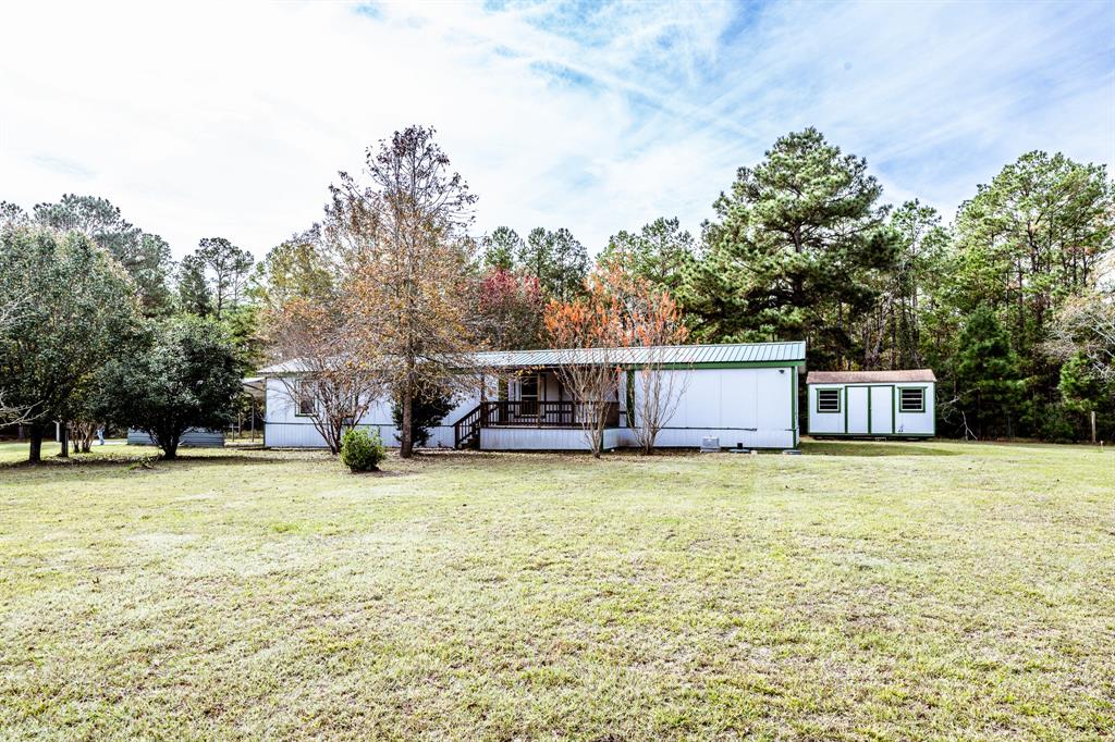 a house with trees in the background