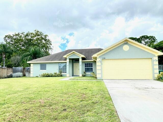 a front view of a house with yard