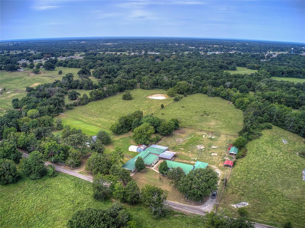 an aerial view of a houses with a yard