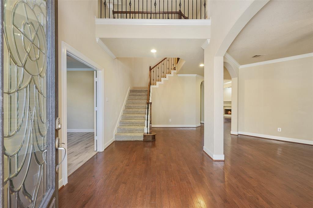 a view of entryway with wooden floor