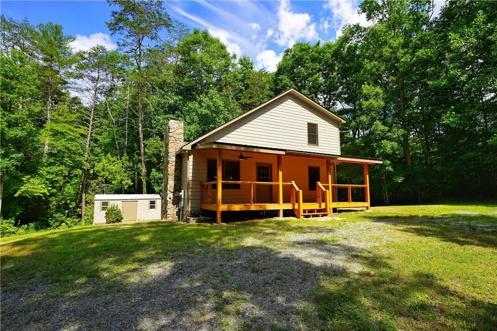 a view of a house with a yard