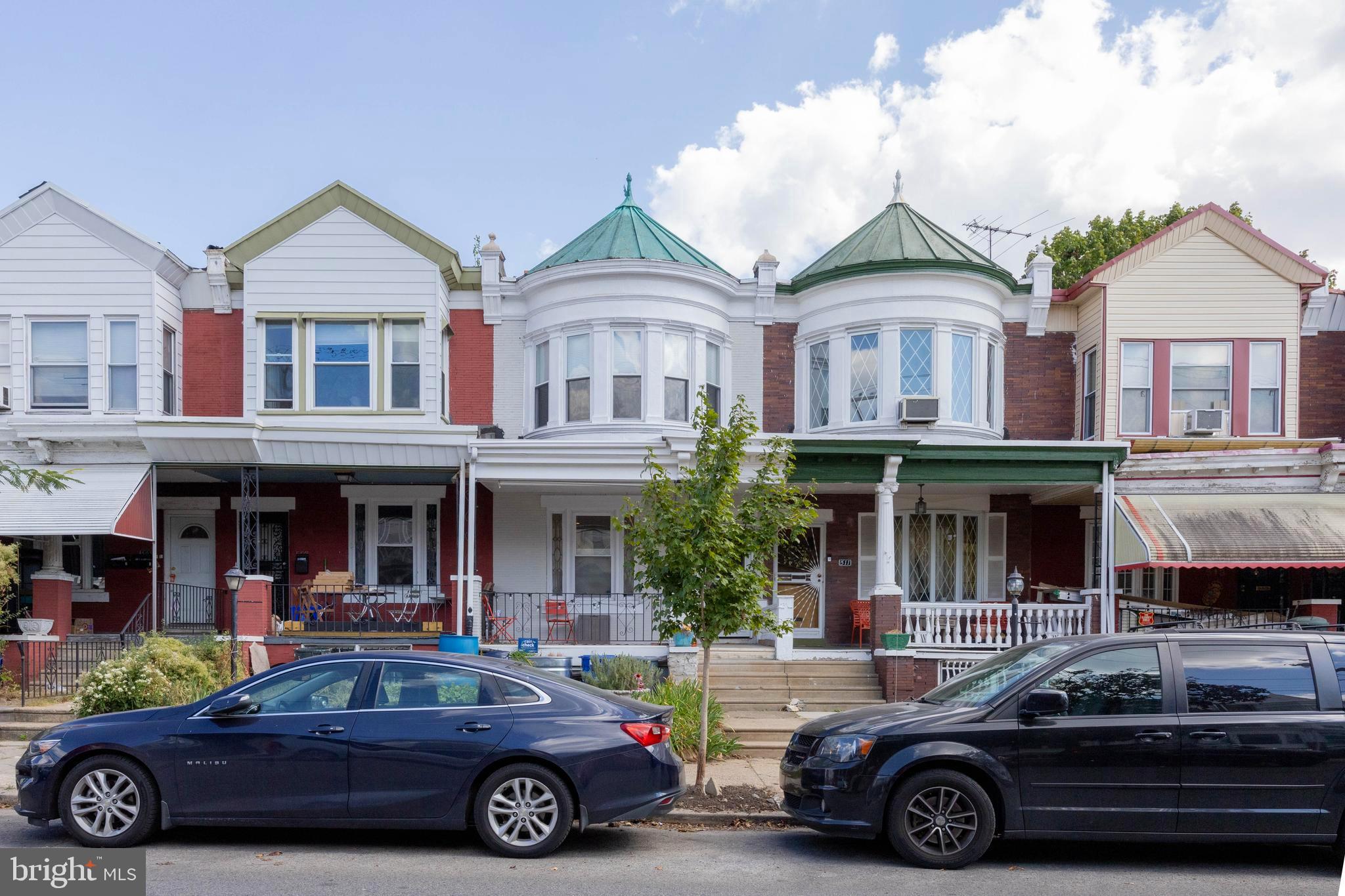 a car parked in front of a houses