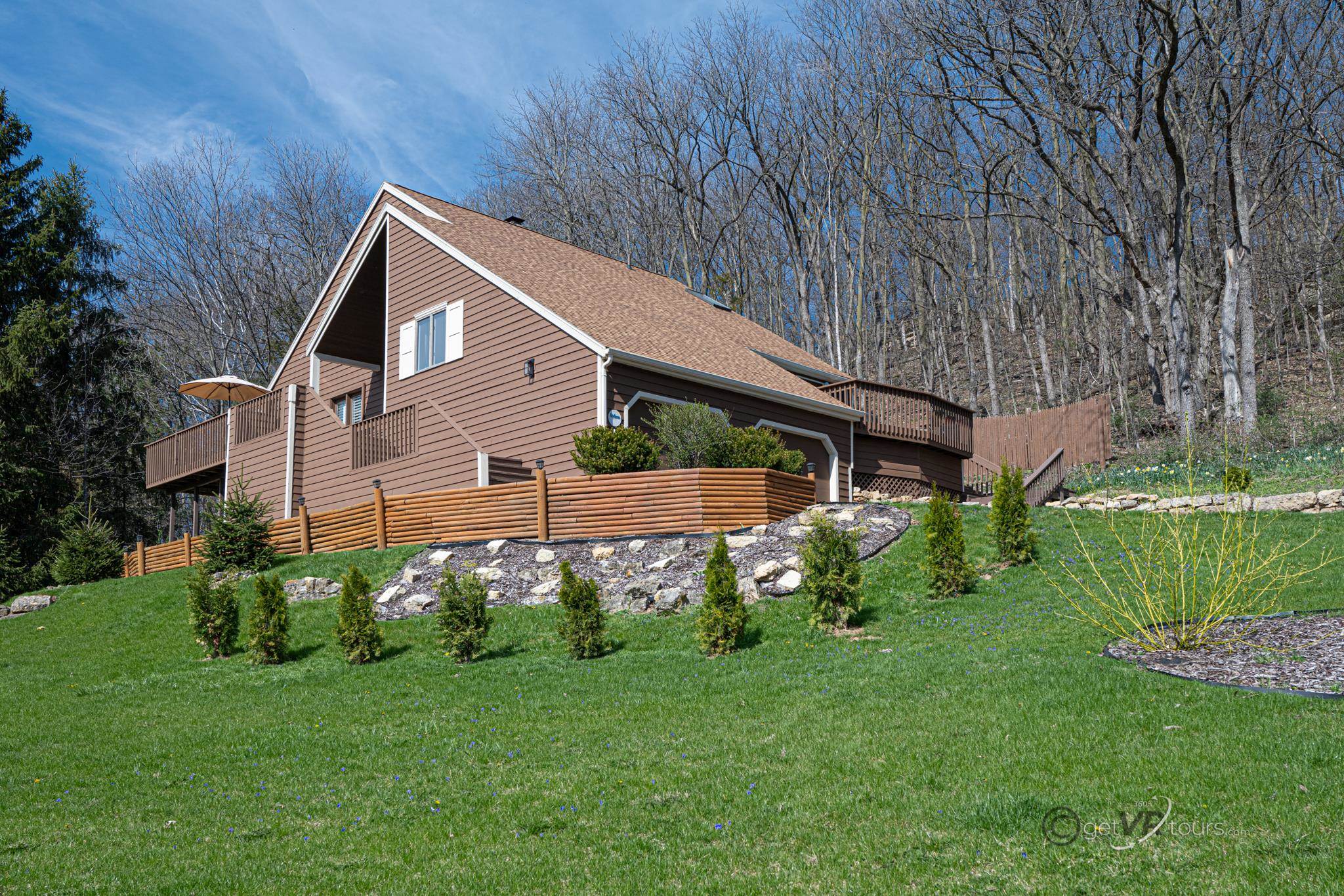 a backyard of a house with lots of green space