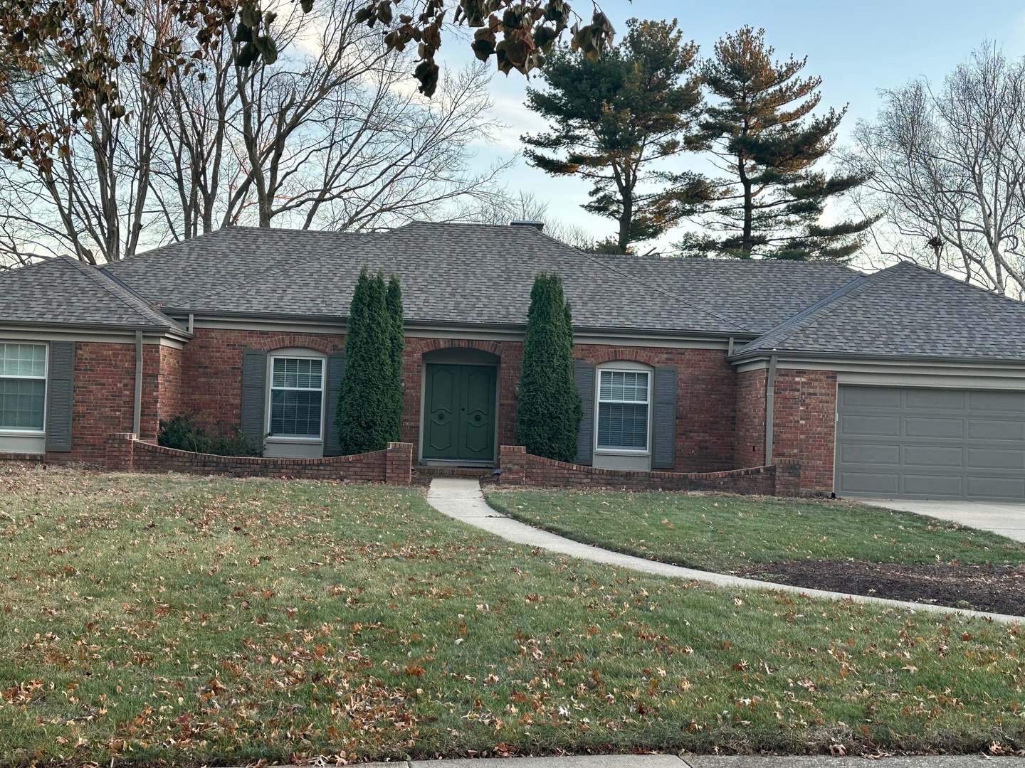 front view of a house with a yard