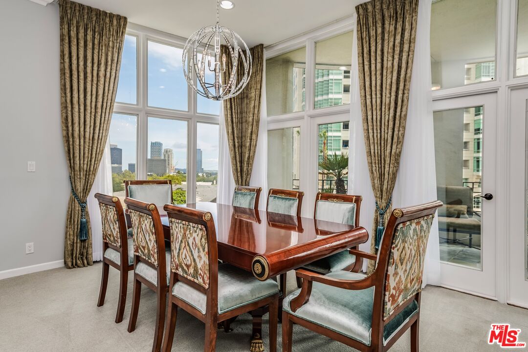 a view of a dining room with furniture and window