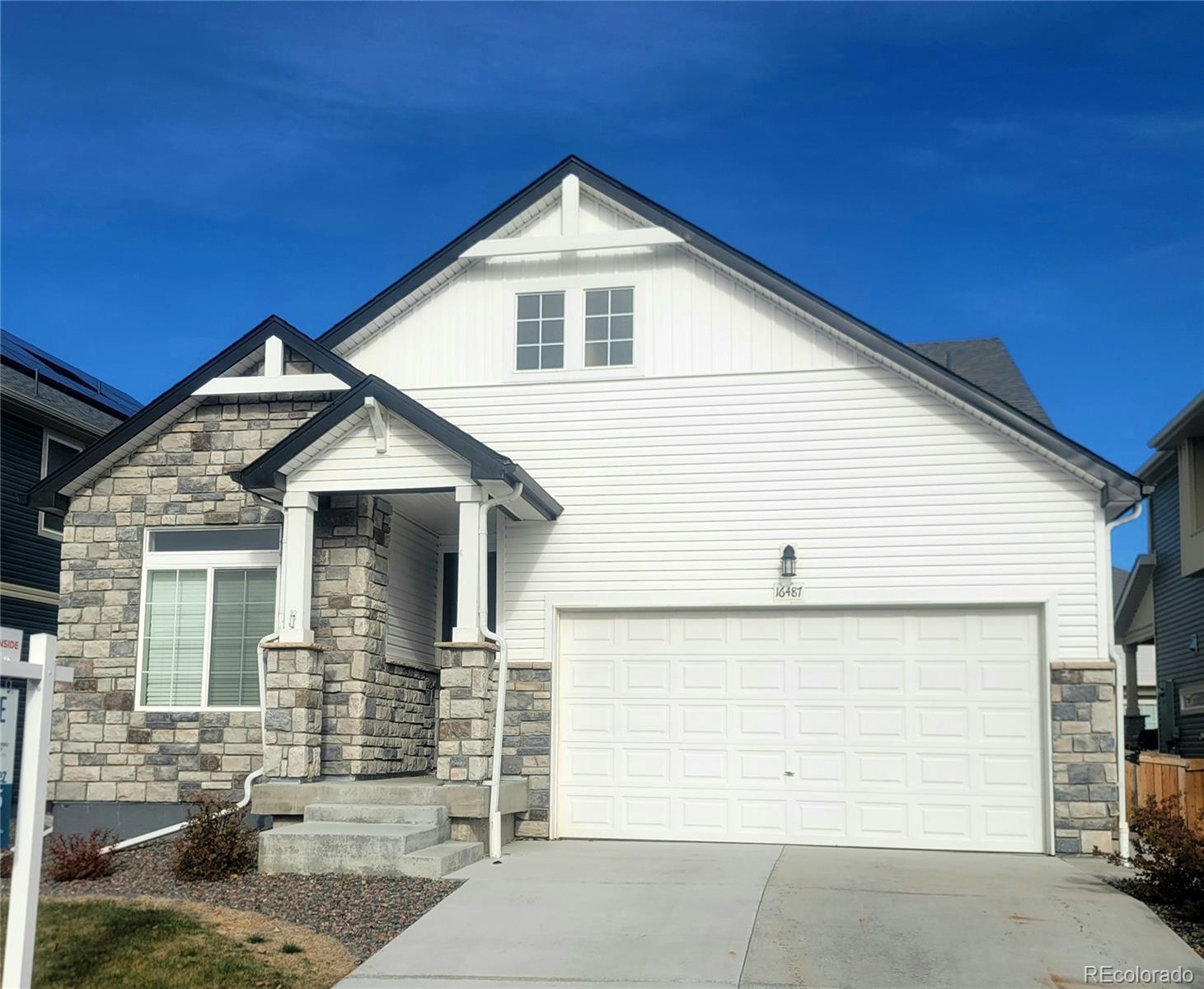 a front view of a house with a garage