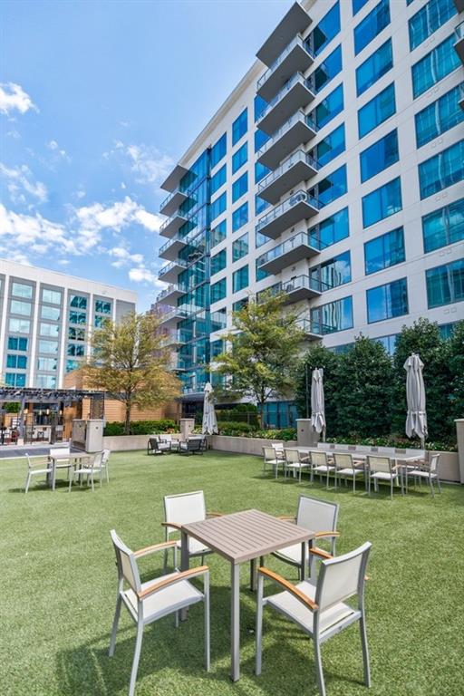 a table and chairs in front of a building