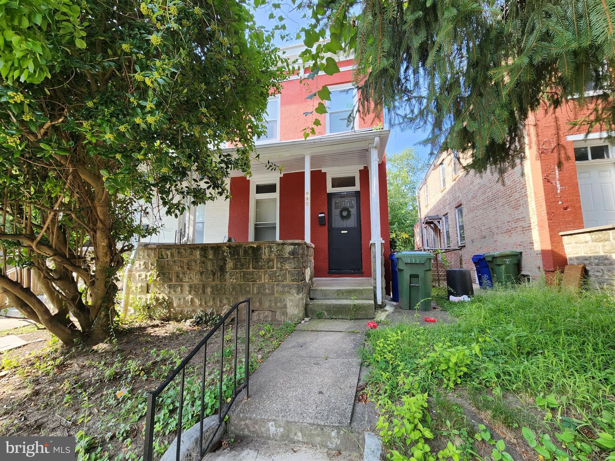 front view of a house with a small yard