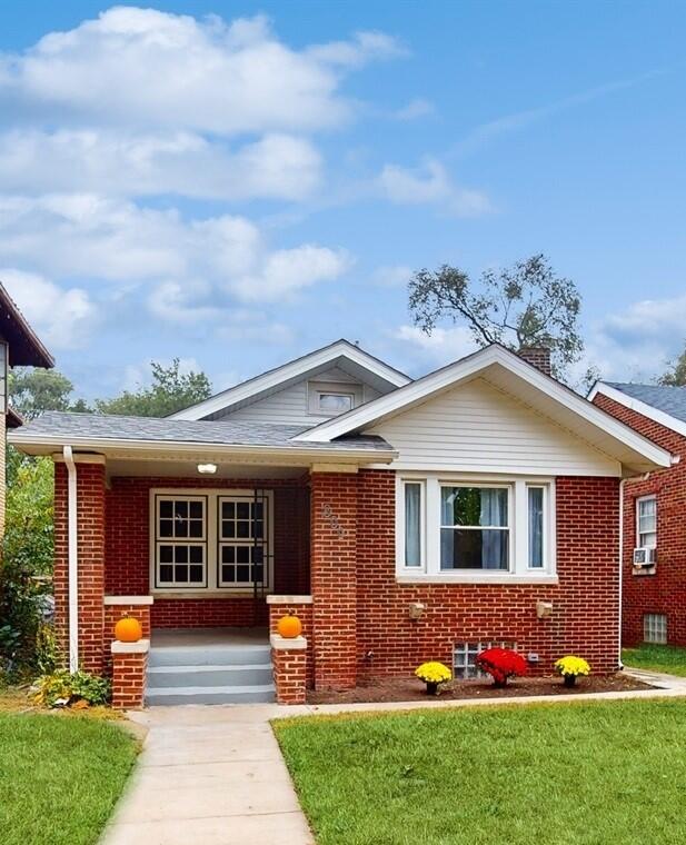 front view of a house with a yard