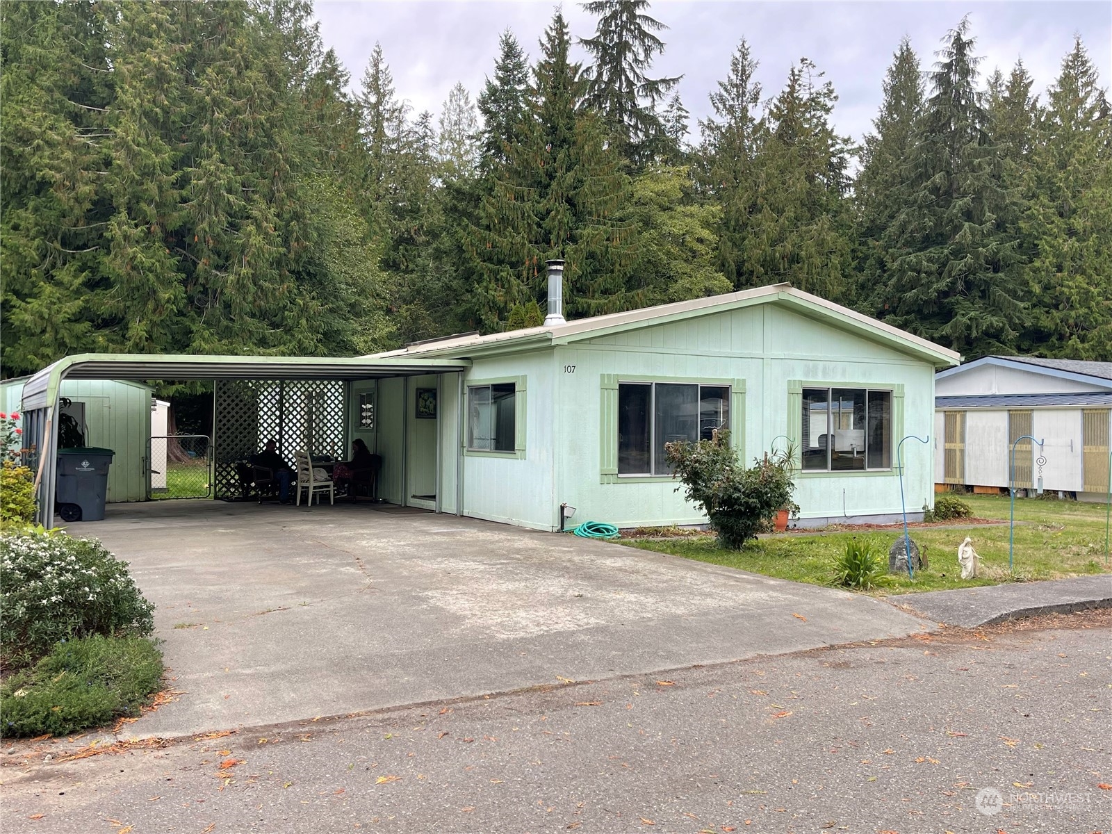 a front view of a house with a yard and porch