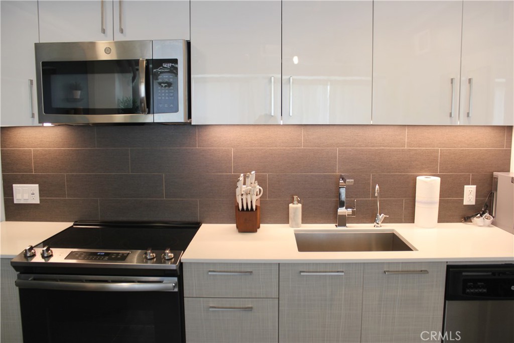 a kitchen with a stove and a microwave