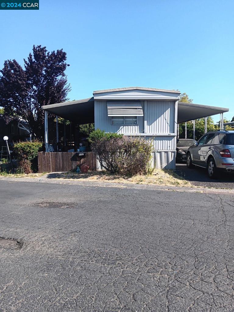 a view of a house with a yard and garage