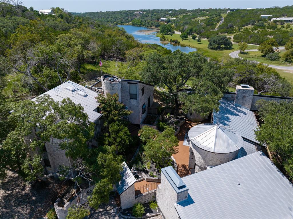 an aerial view of a house with yard and outdoor seating