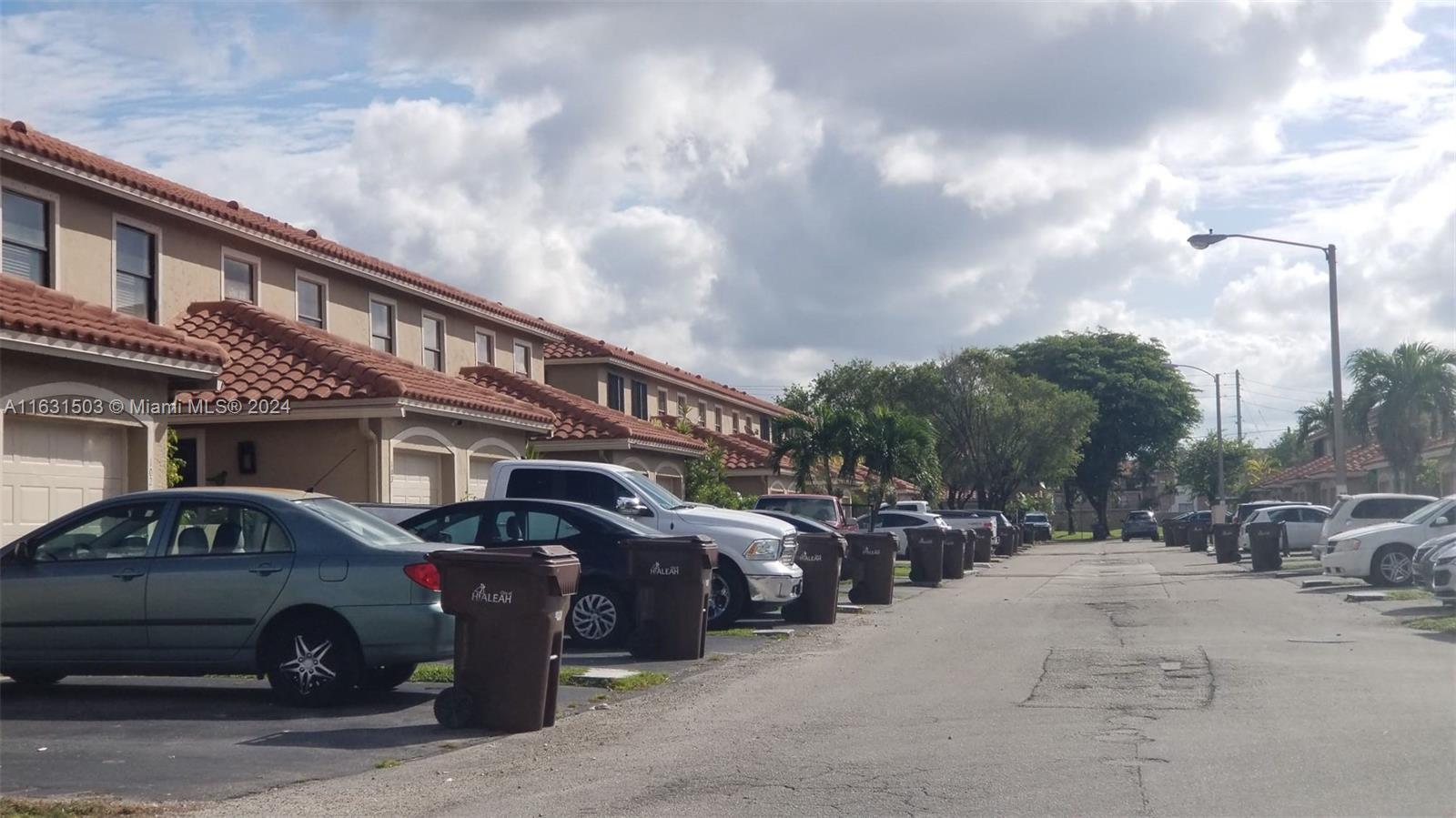 a front view of a house with parking lot