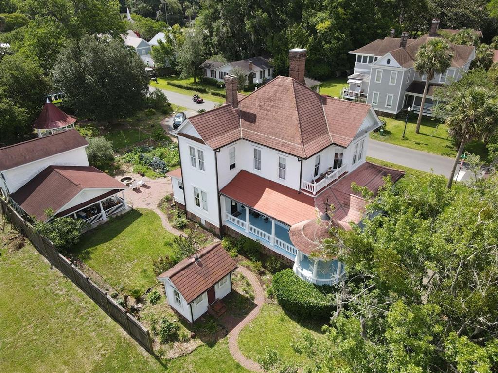 an aerial view of a house with a garden