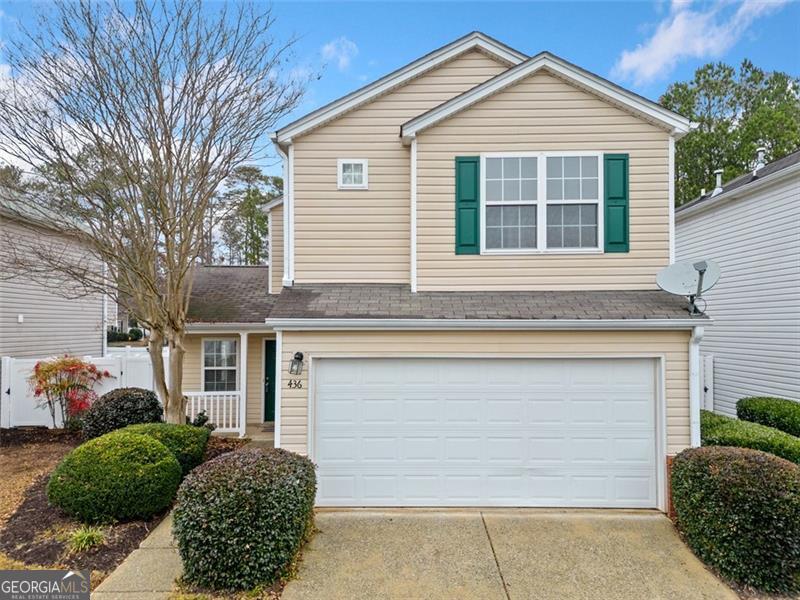 a front view of a house with a garage