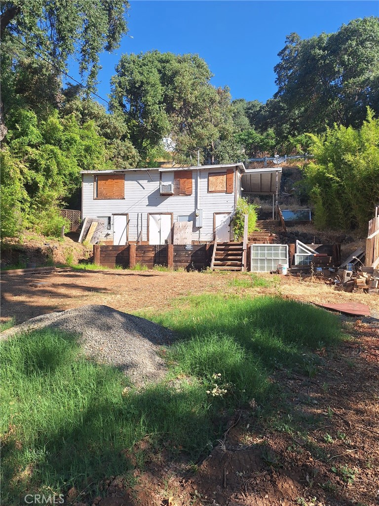 an outdoor view of a house with a yard