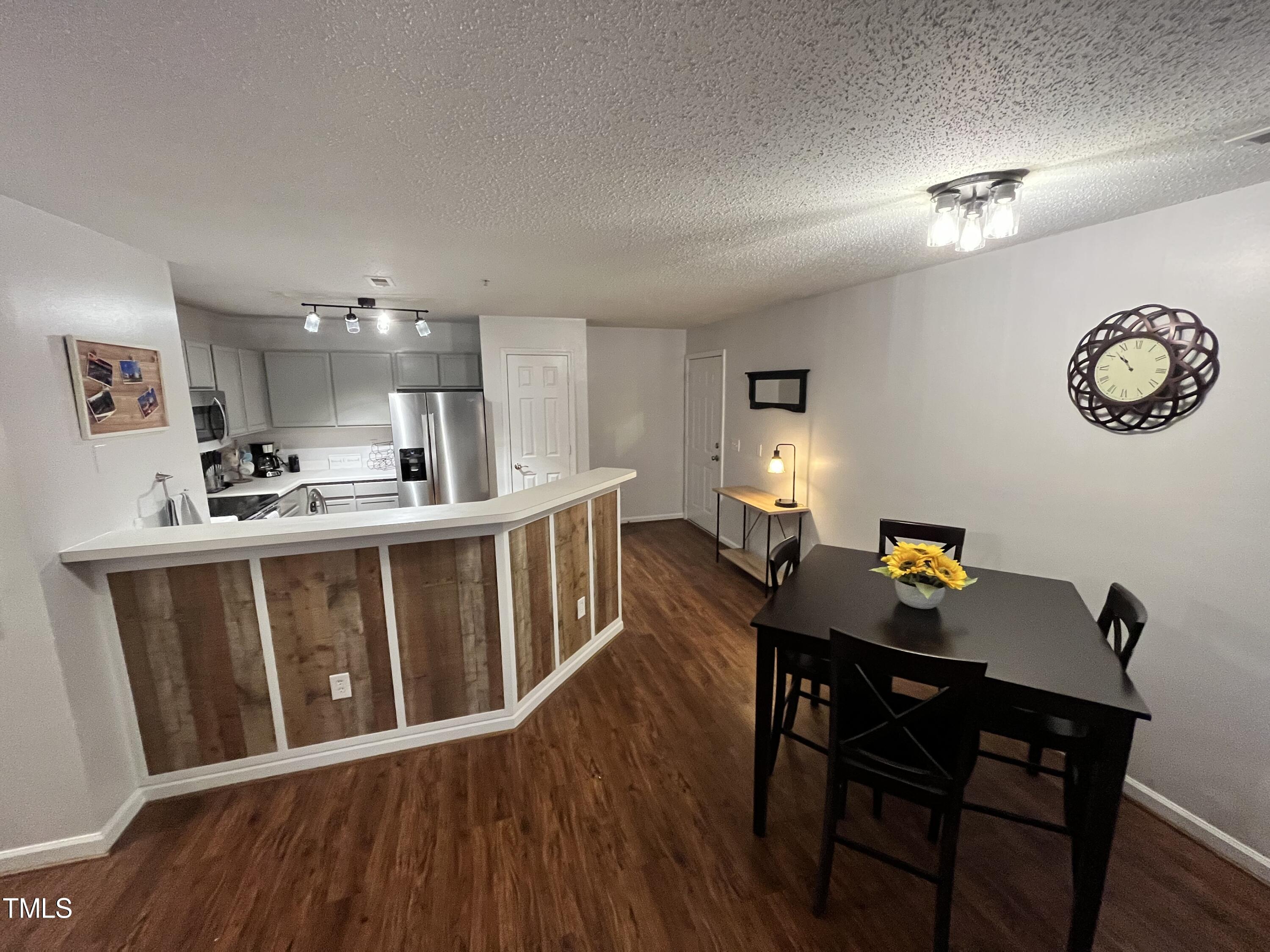 a view of a dining room with furniture wooden floor and a rug