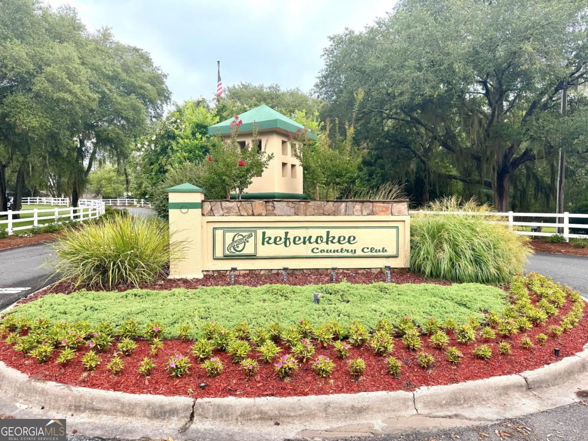 a view of a park with welcome board