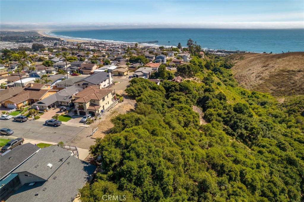 an aerial view of a houses with a yard