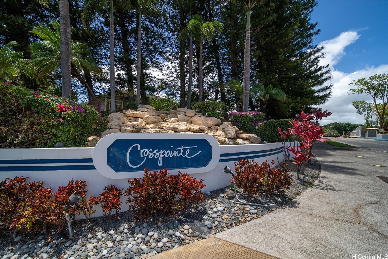 a view of a sign board with wooden fence