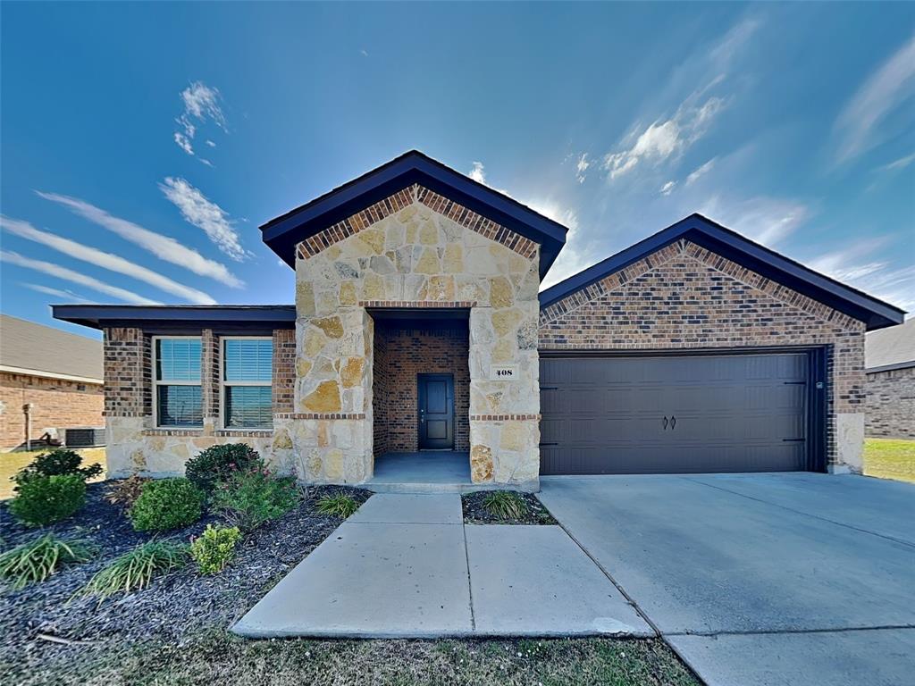 a front view of a house with garage