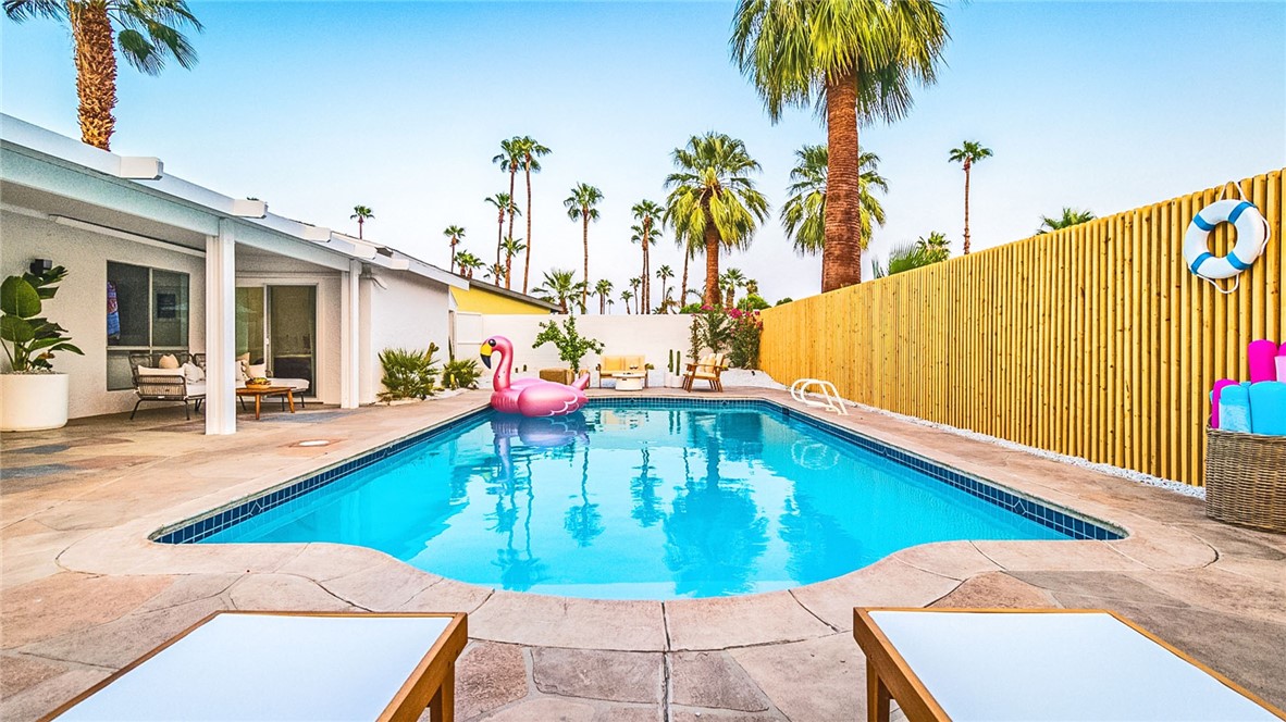 a view of a swimming pool with a chair