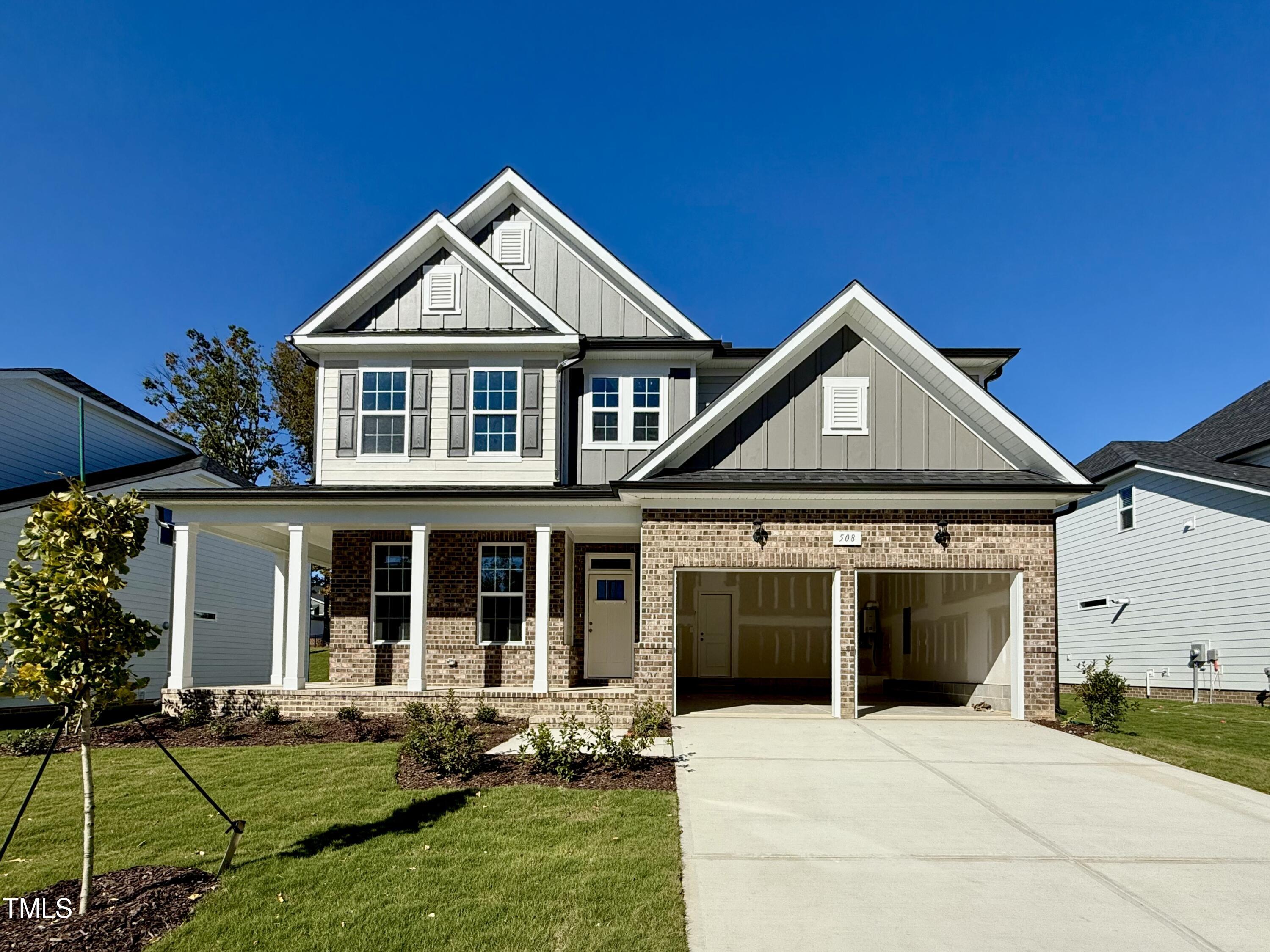 front view of a house with a yard