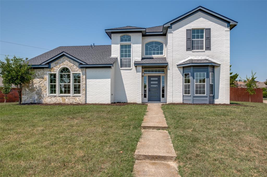 front view of a house with a yard