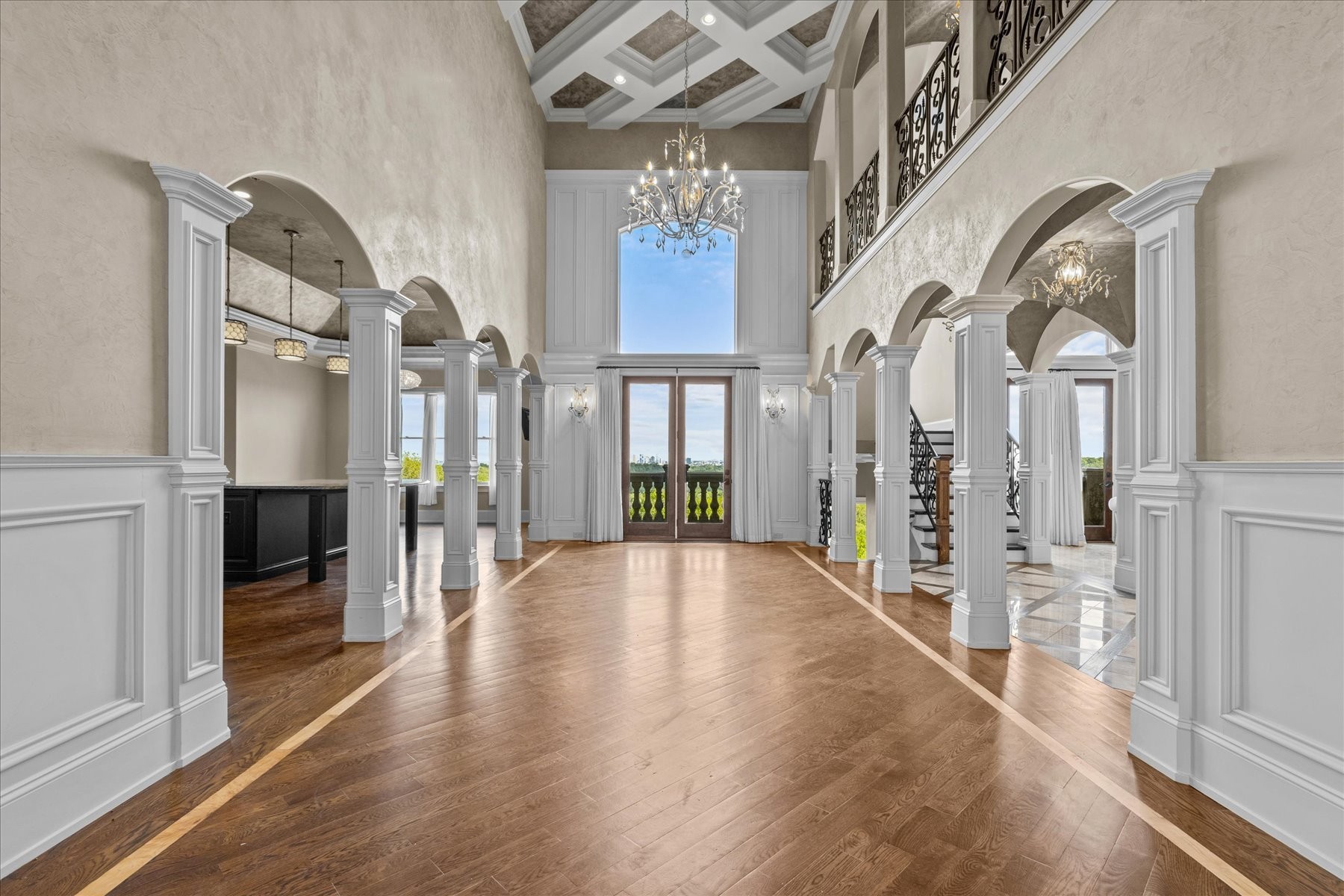 a view of an entryway with wooden floor