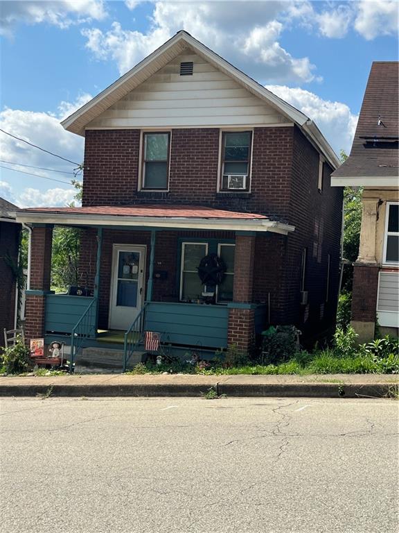 a front view of a house with yard