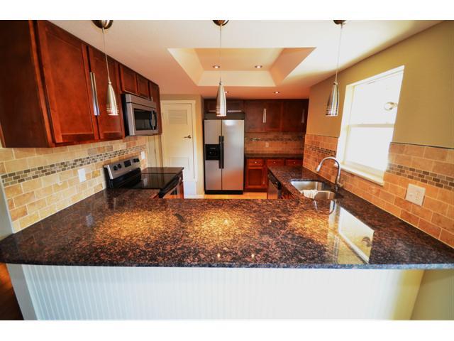 a view of kitchen with furniture and a window