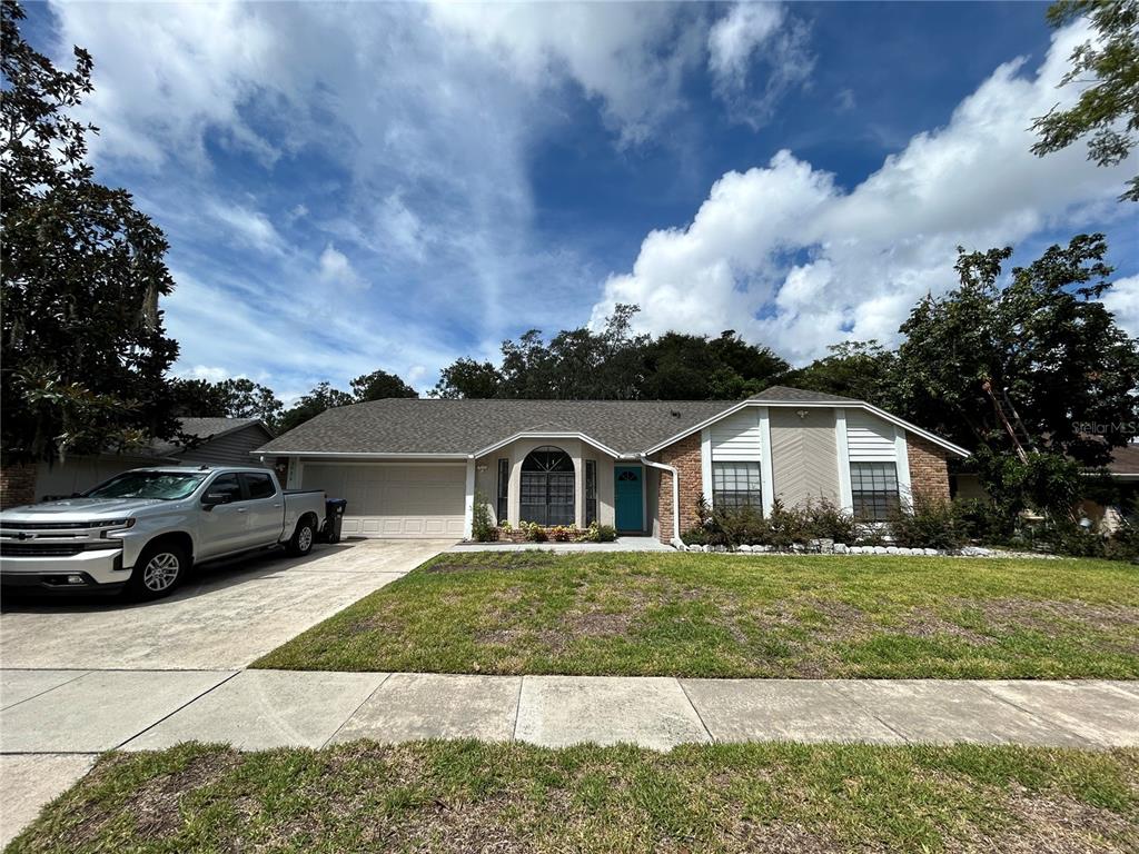 a view of a house with a yard