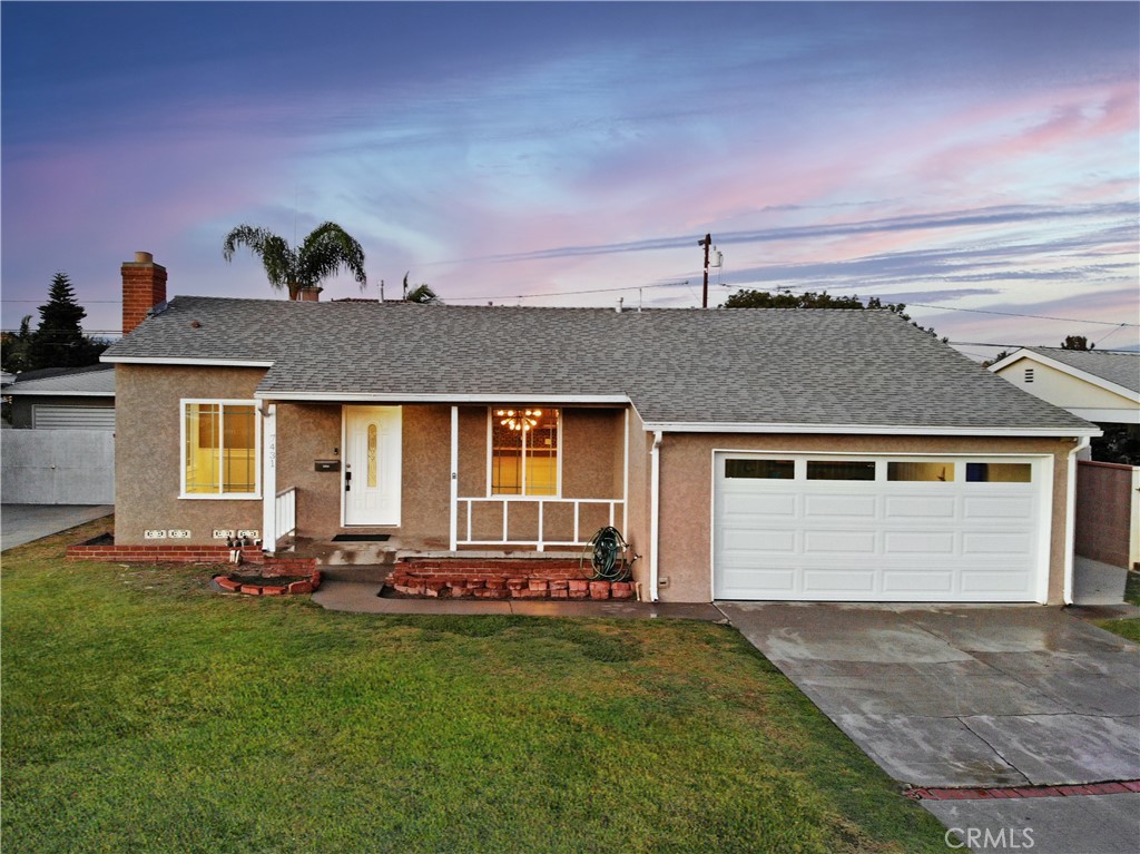 front view of a house with a yard