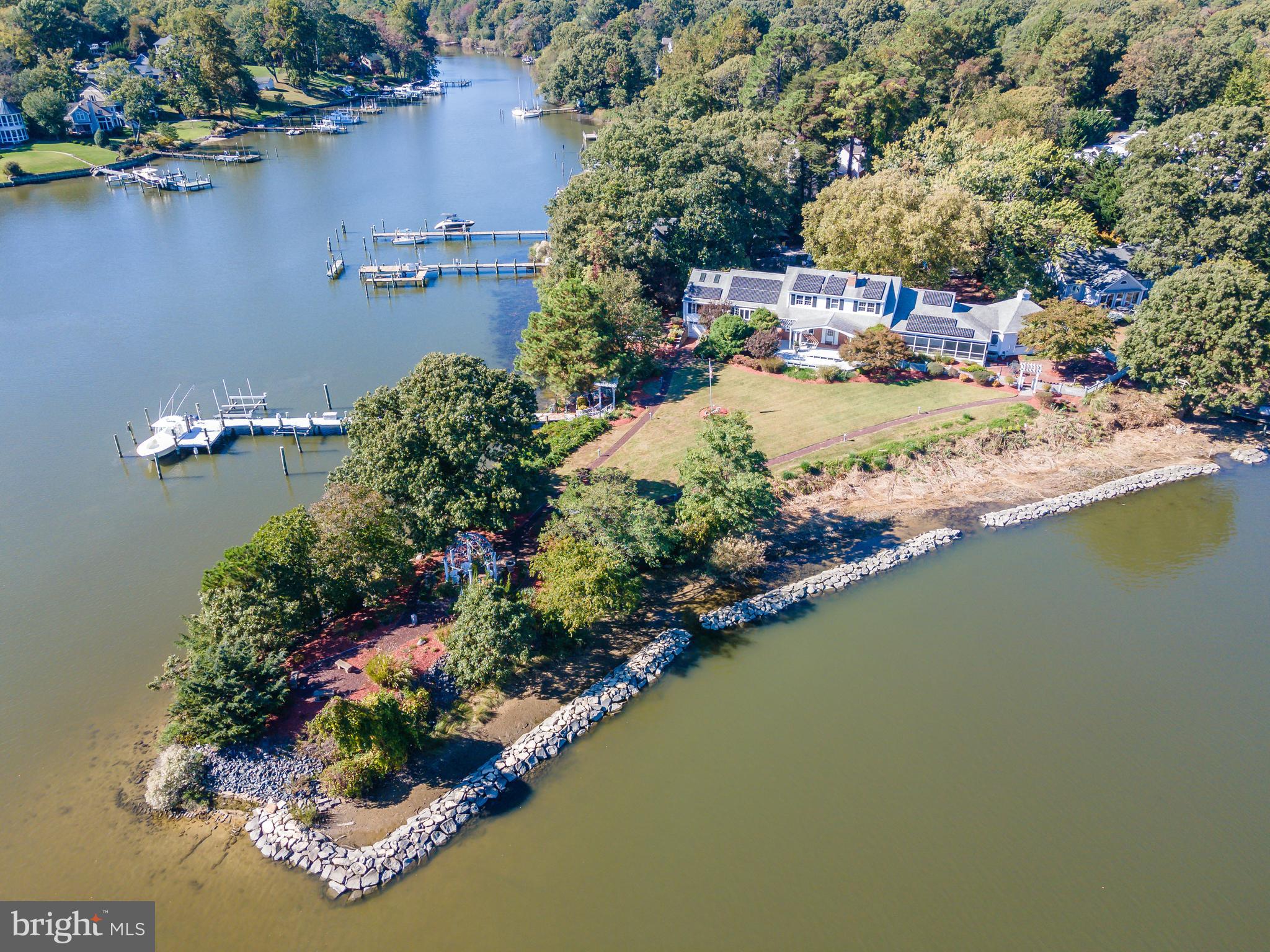 an aerial view of residential house with outdoor space and lake view