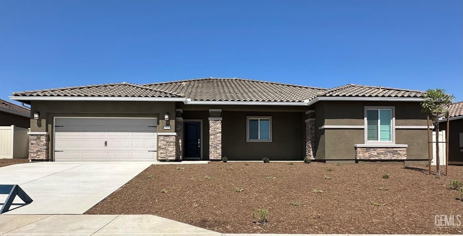 a front view of a house with a garage