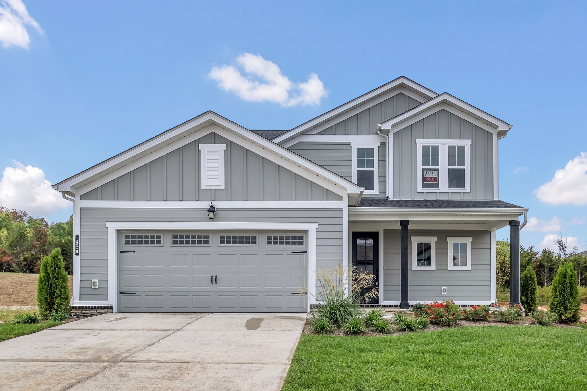 a front view of a house with garage