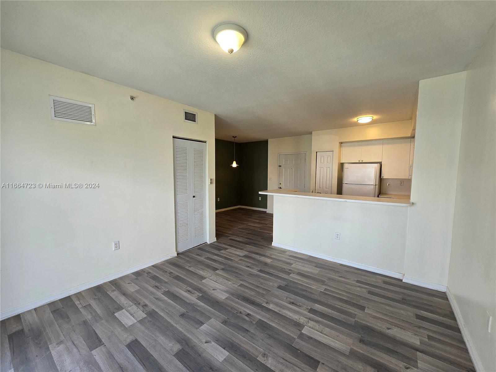 a view of a livingroom with wooden floor