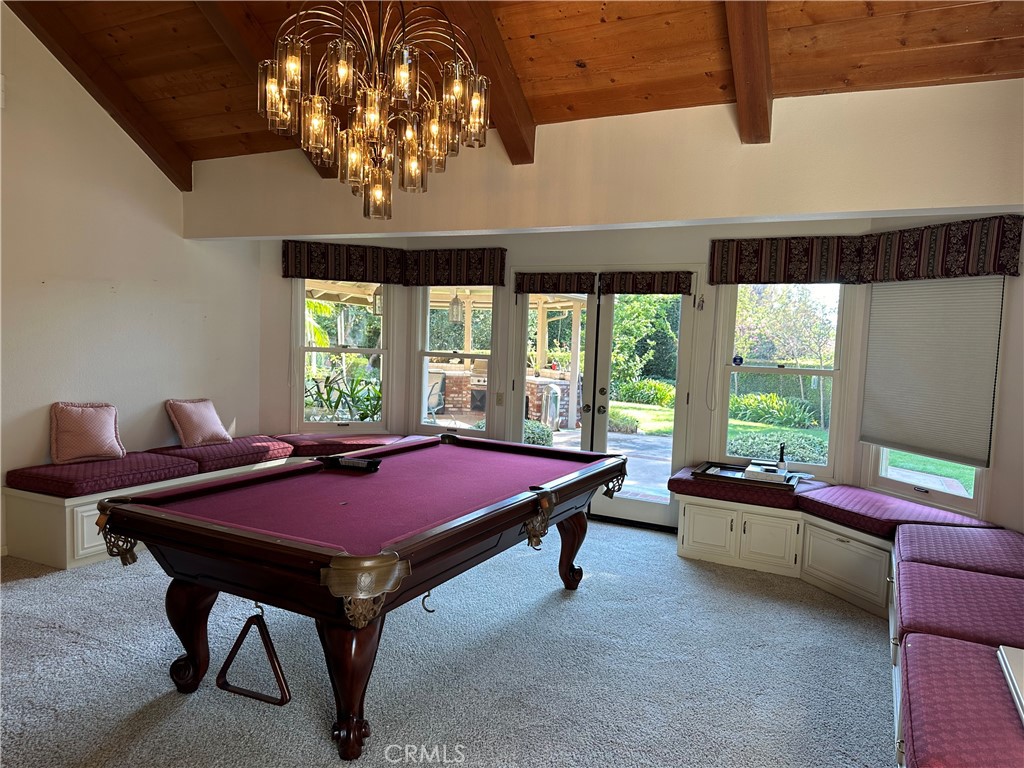 Built-in Seating with Storage & French Doors that lead to the outdoor Kitchen & covered Patio