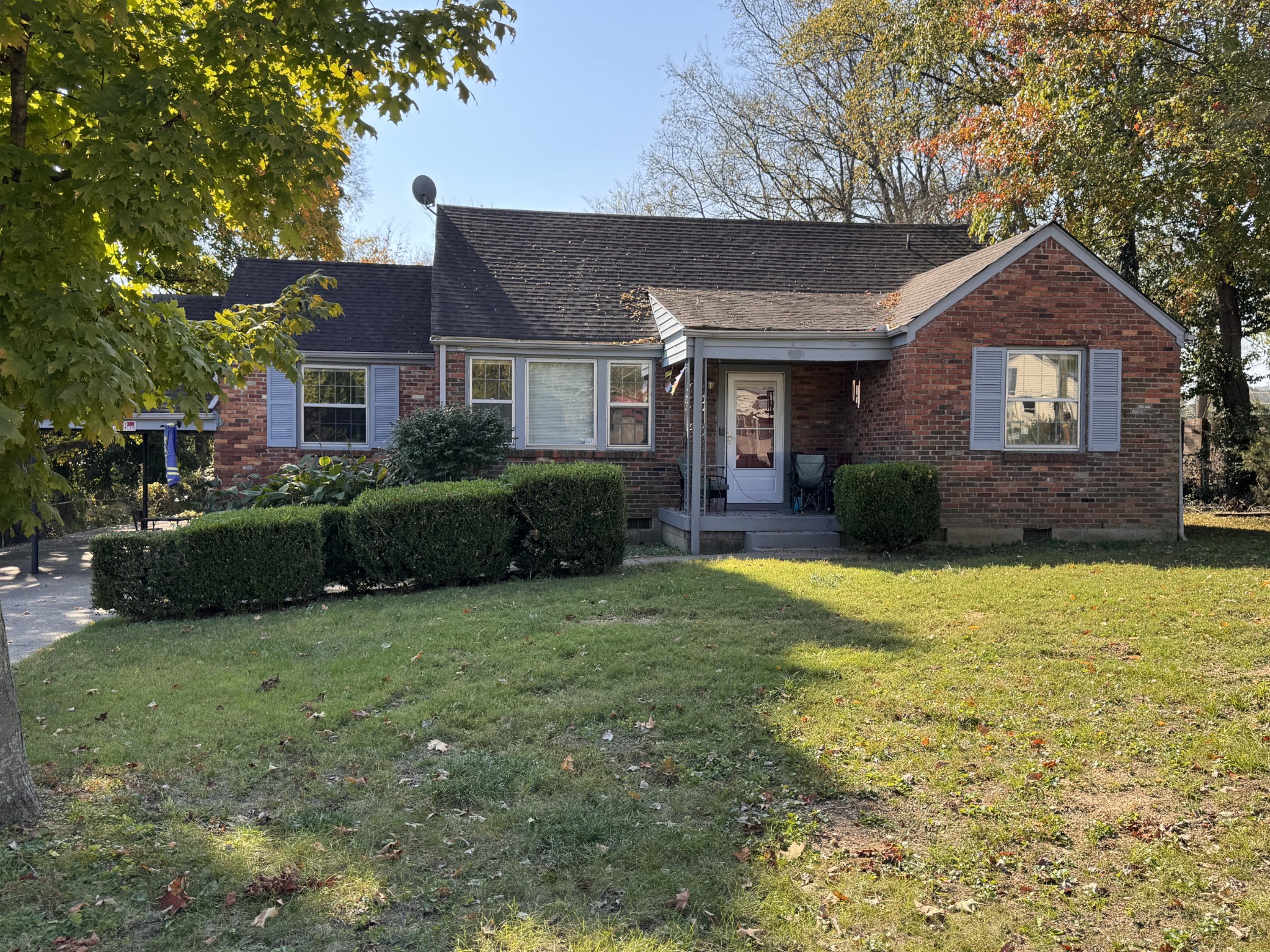 a front view of a house with a garden