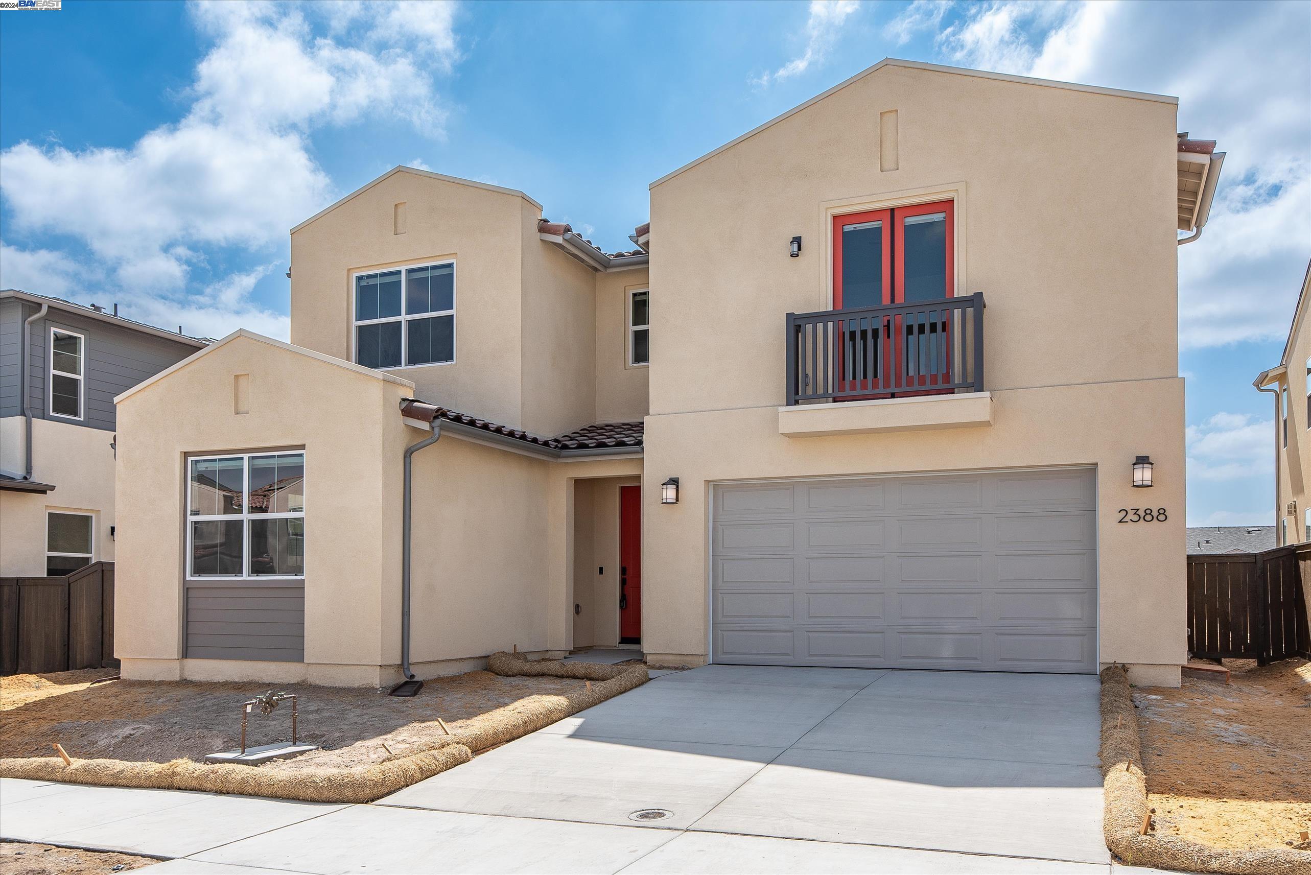 a front view of a house with a garage