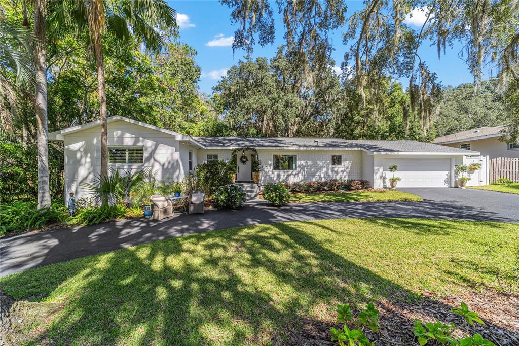 a view of house with yard outdoor seating and entertaining space