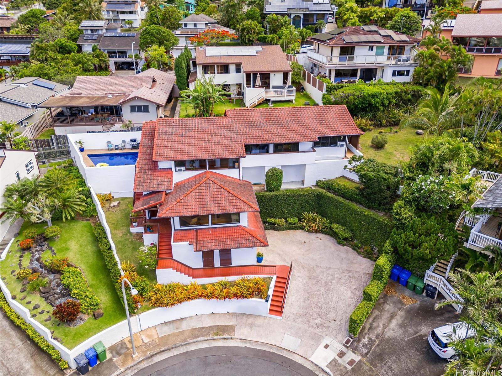 an aerial view of multiple houses with yard