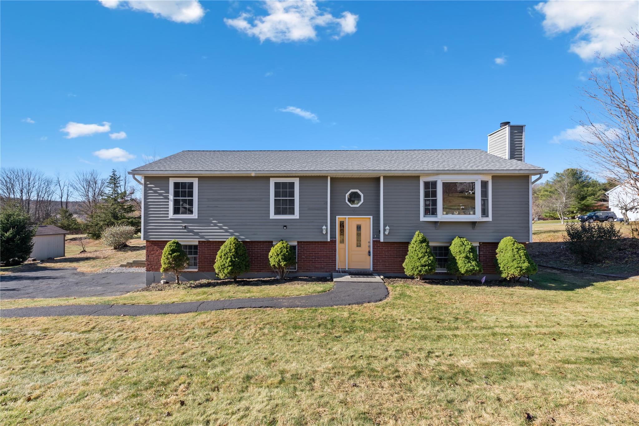 a front view of a house with a yard