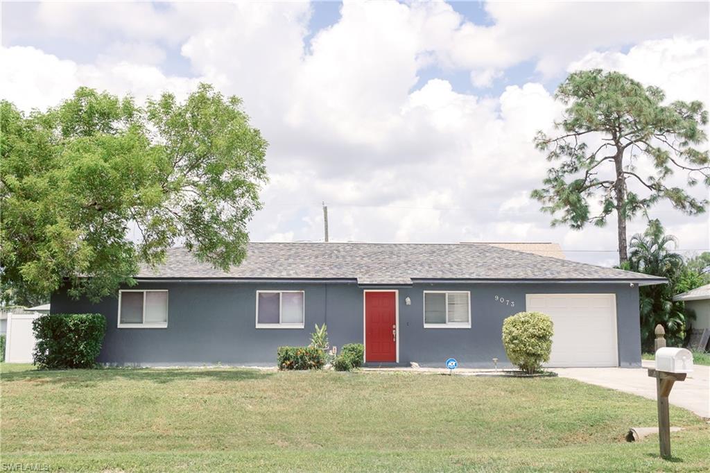 a front view of a house with yard