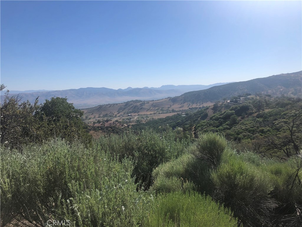 a view of a town with mountains in the background