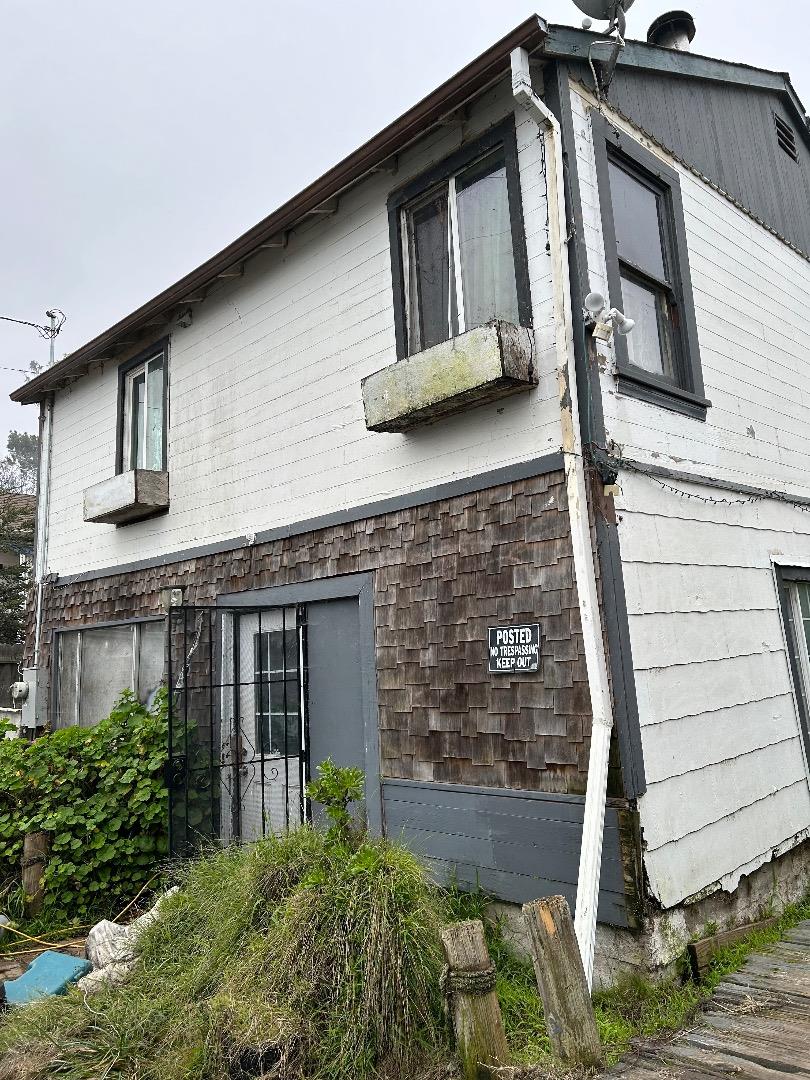 a front view of a house with garage