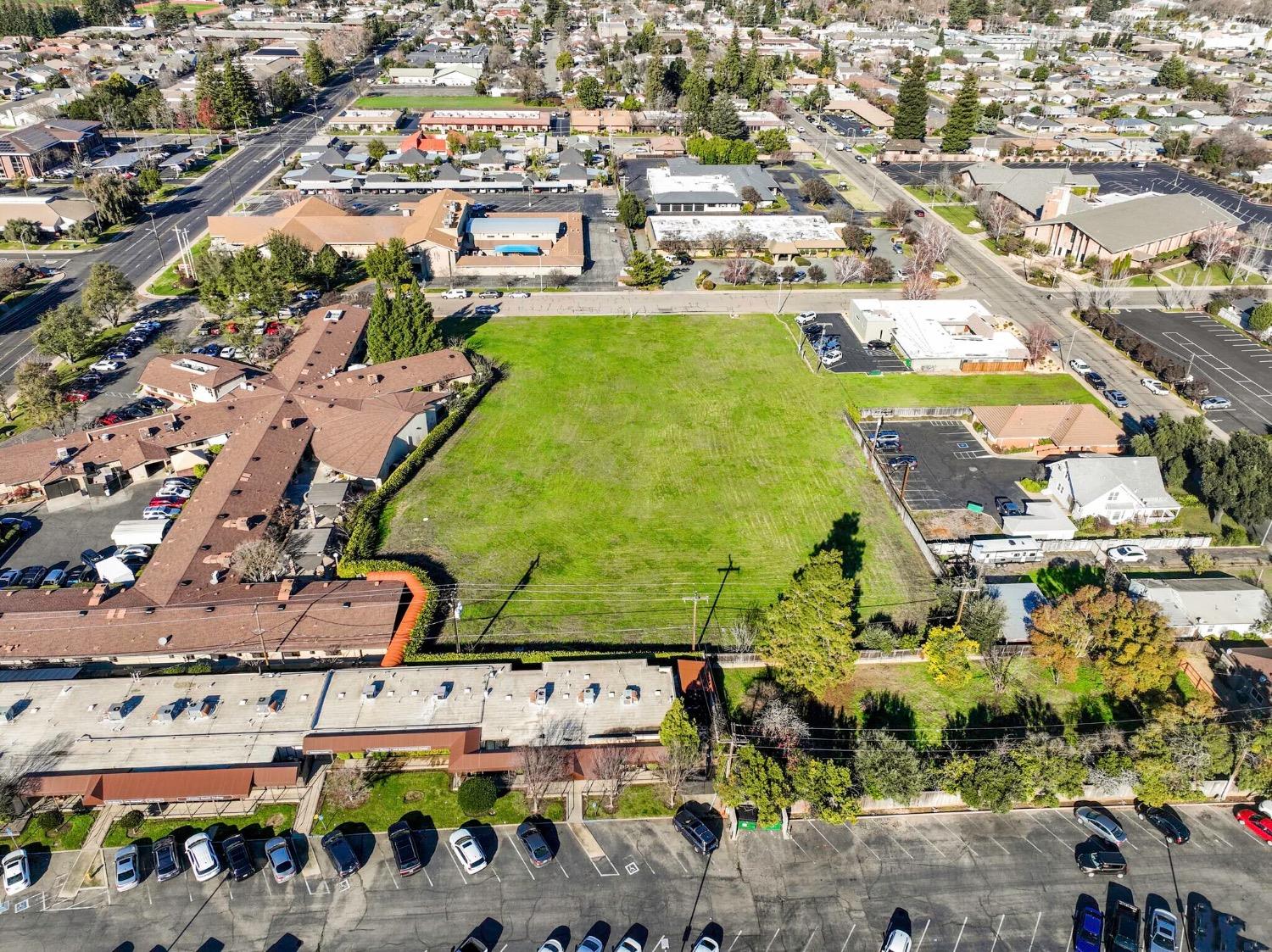 an aerial view of residential houses with outdoor space