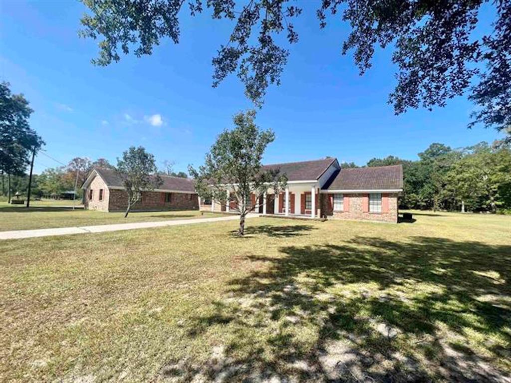 a view of a house with a big yard