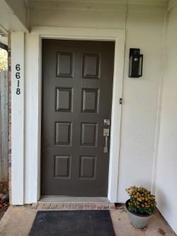 a view of a door and a chair